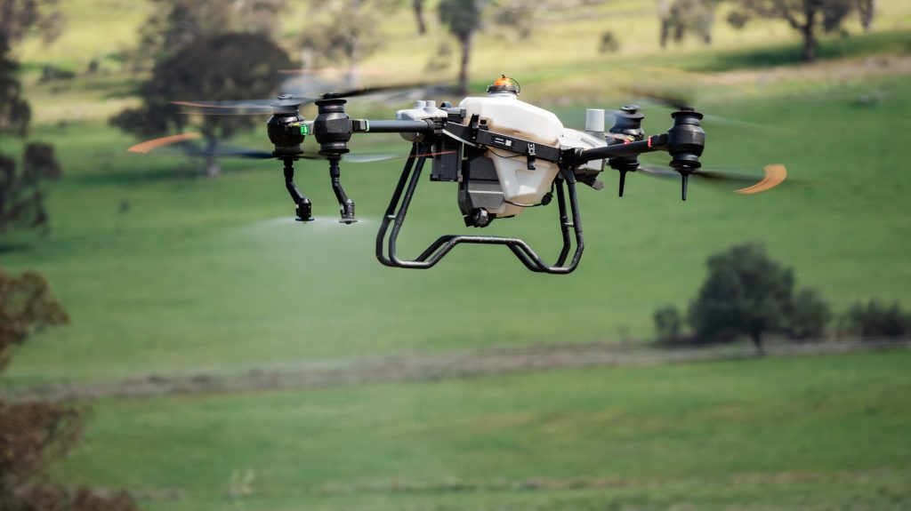 DJI T40 Spray drone in flight Spraying liquid