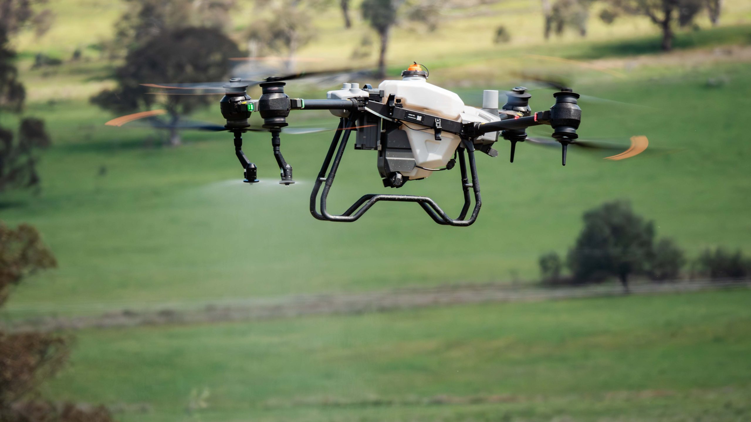 DJI T40 Spray drone in flight Spraying liquid